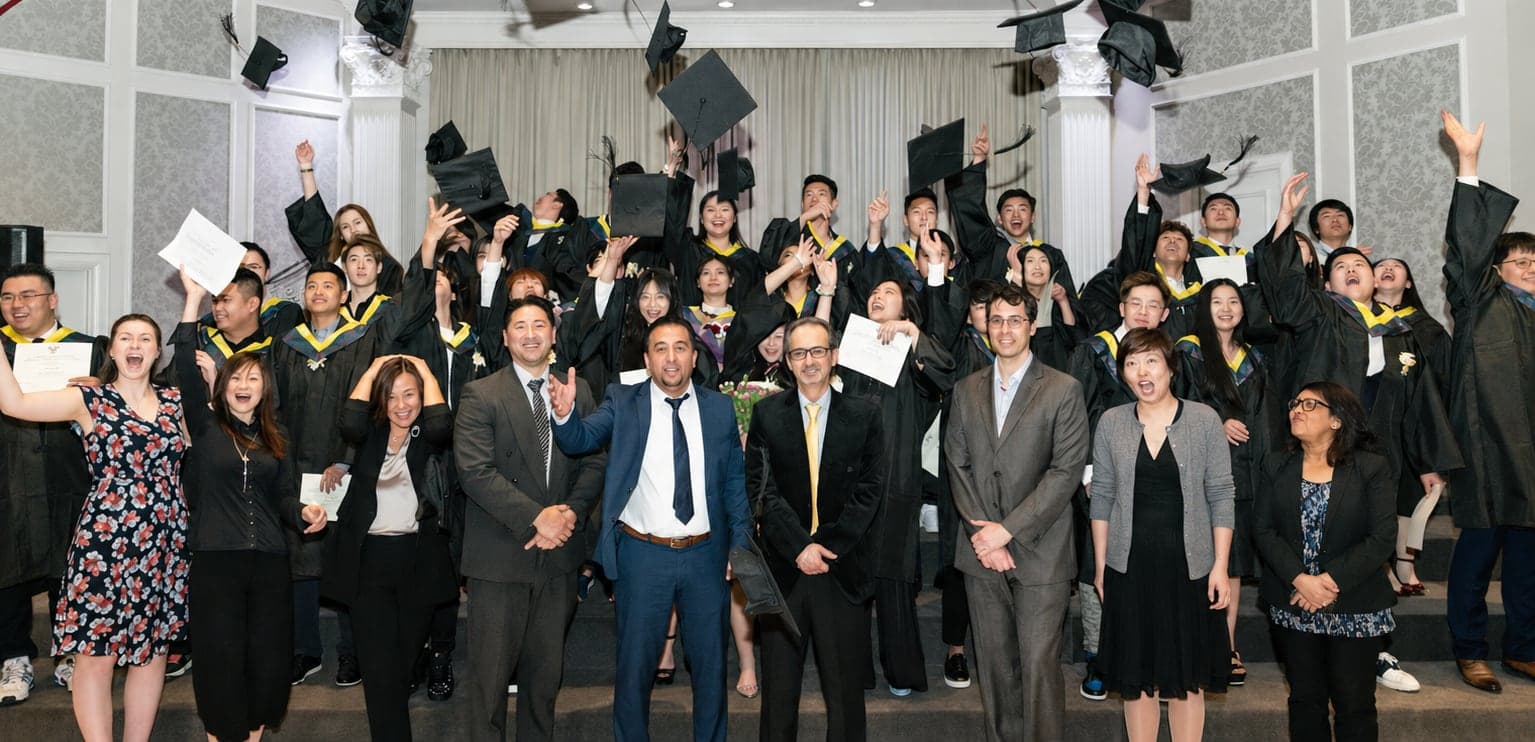 Heuristic Academy graduates celebrating at commencement